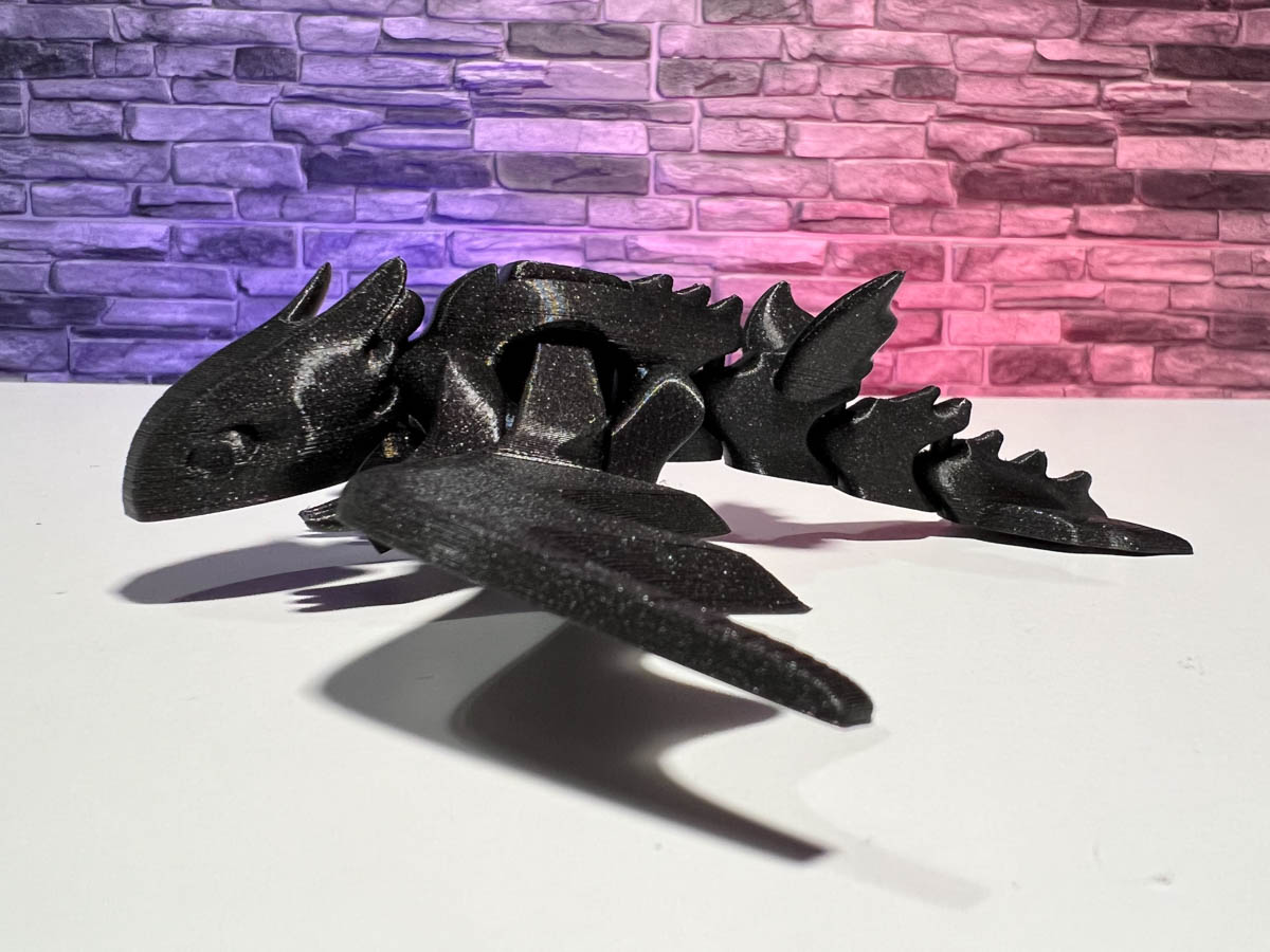 STL file Articulated Pyro, our cute flexi dragon fidget toy, its