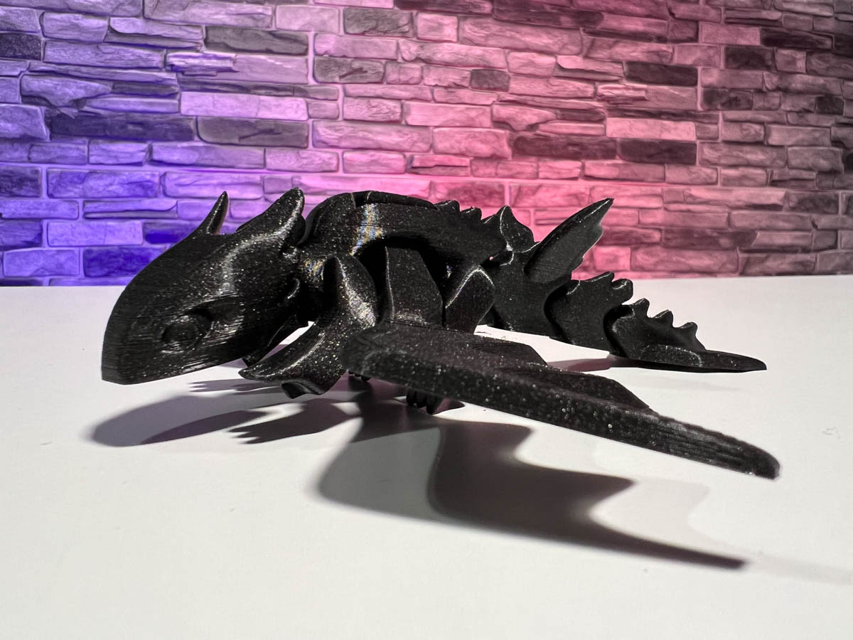 STL file Articulated Pyro, our cute flexi dragon fidget toy, its